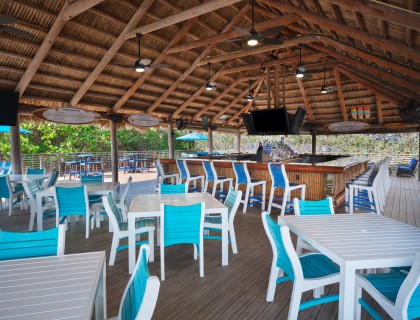 a patio with tables and chairs