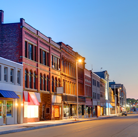 a street with buildings and shops on the side