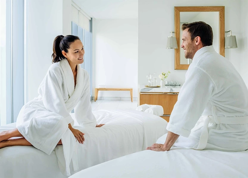 a man and woman in white robes