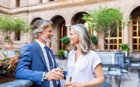 couple sitting outside having drinks on the roof