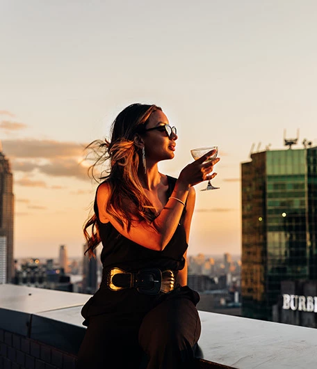 a woman holding a glass of wine