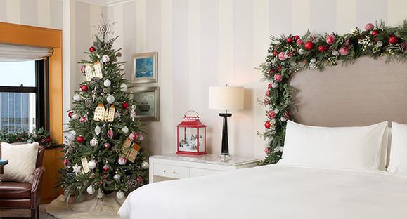 a bed with a christmas tree