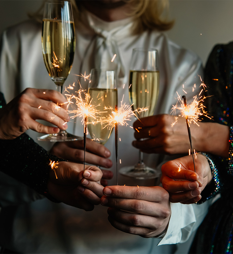 a group of people holding champagne glasses