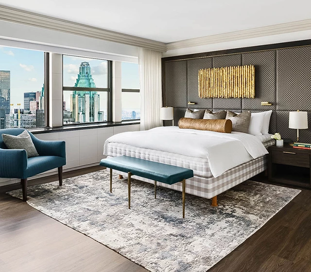 a bedroom with a large window