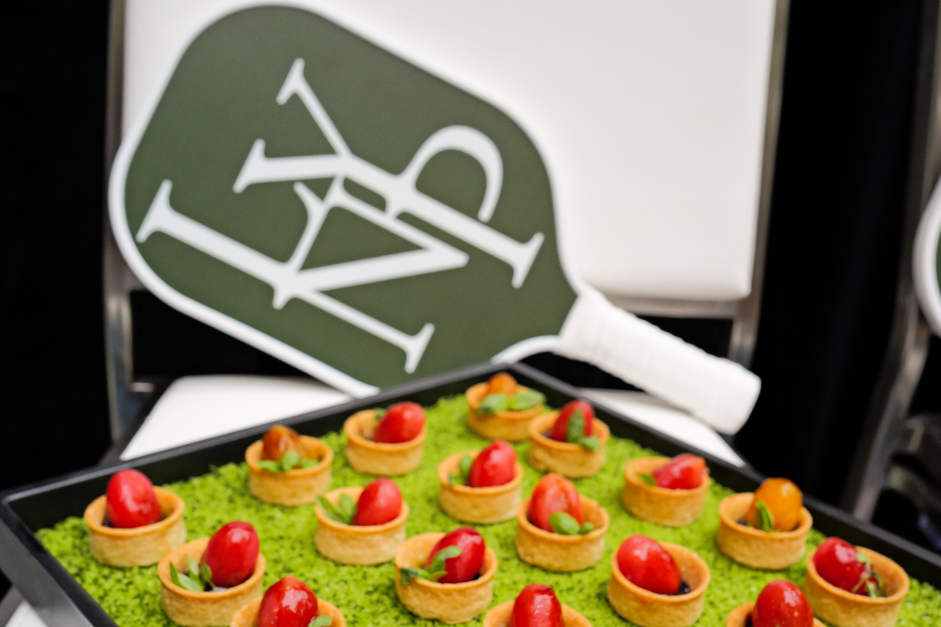 a tray of food with a paddle