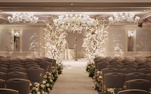 a wedding ceremony with chairs and flowers