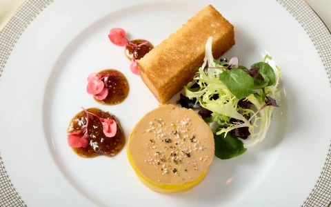 a plate of food on a white surface