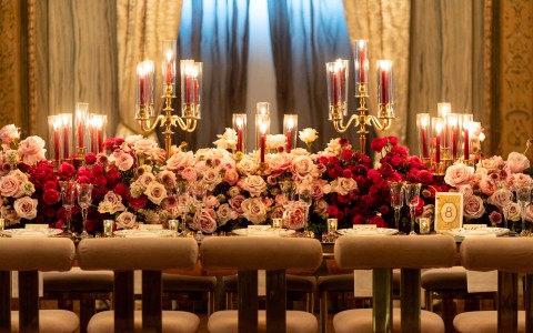 a table with flowers and candles