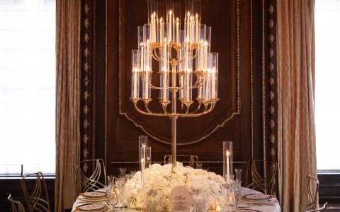 a chandelier over a table