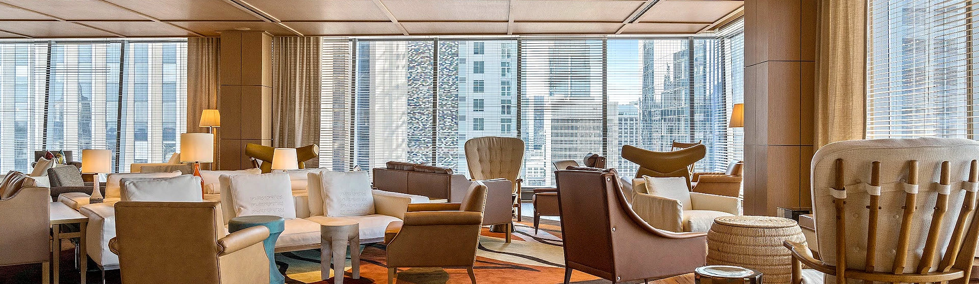 seating area next to the large windows with the city view