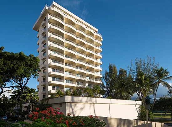 a building with balconies and trees