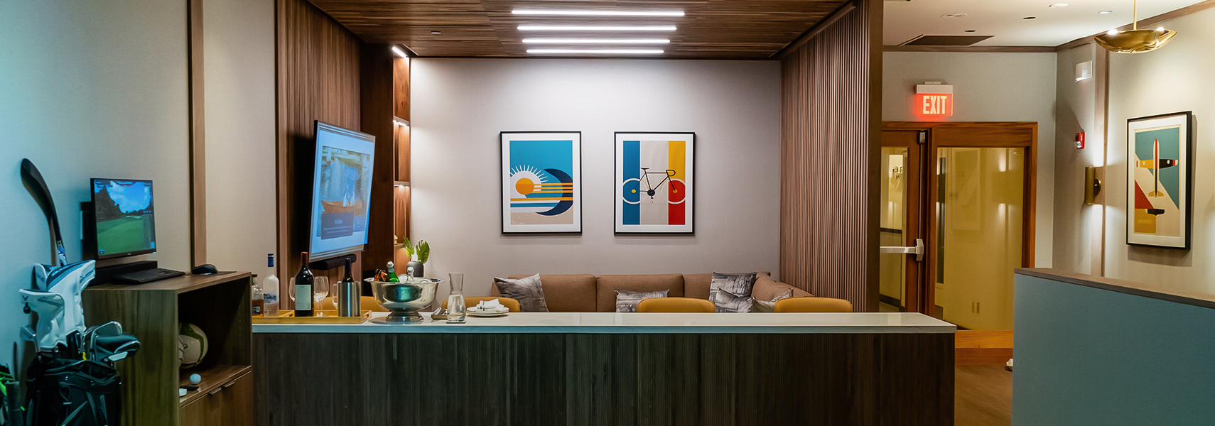 a room with a couch and art on the wall