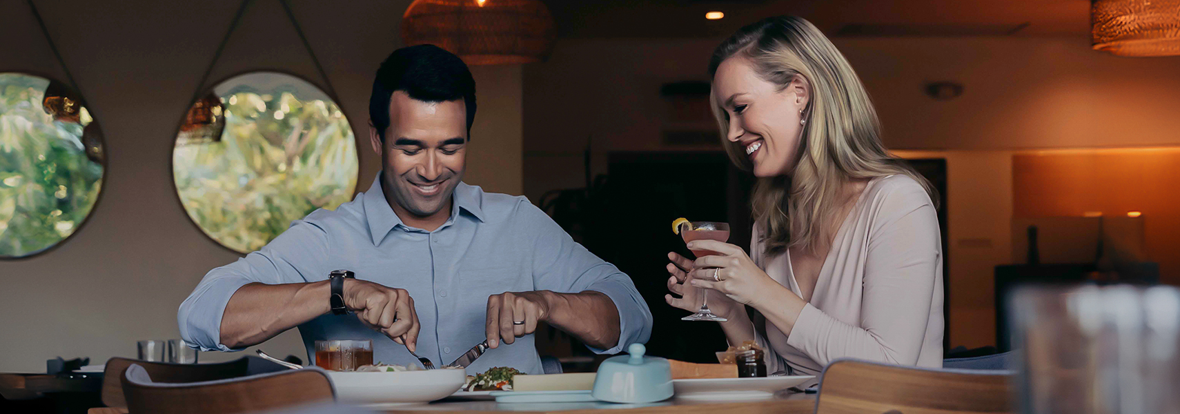 a man and woman eating at a table