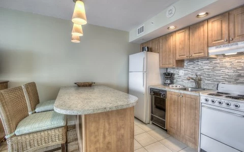 Full kitchen with bar and seating