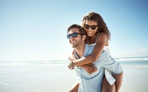 Woman piggy backing on guy