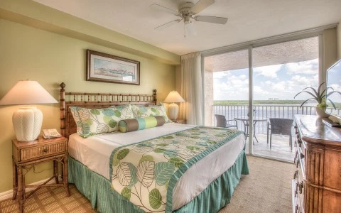 Room with bed and wooden dresser