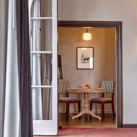 a room with a table and chairs