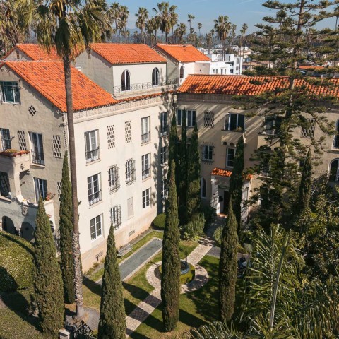 a building with trees and a courtyard