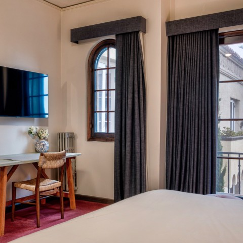 a room with a bed and a tv