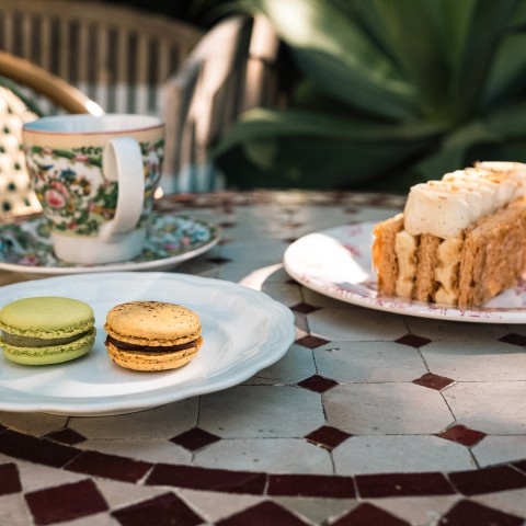 a plate of desserts and a cup of coffee on a table