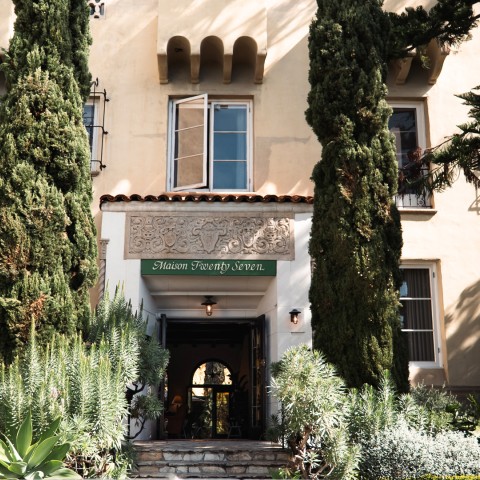 a building with trees and plants