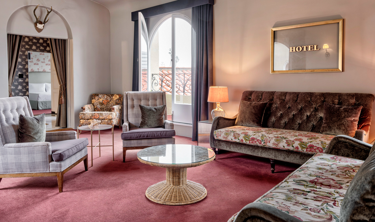 a room with couches and chairs