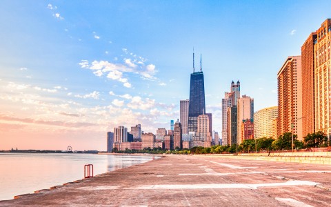 a city skyline with a body of water