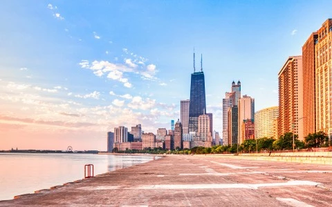 a city skyline with a body of water