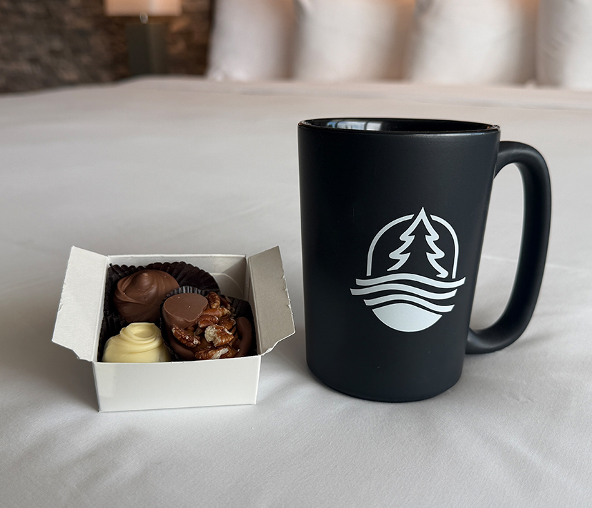 a cup of coffee and a box of chocolates