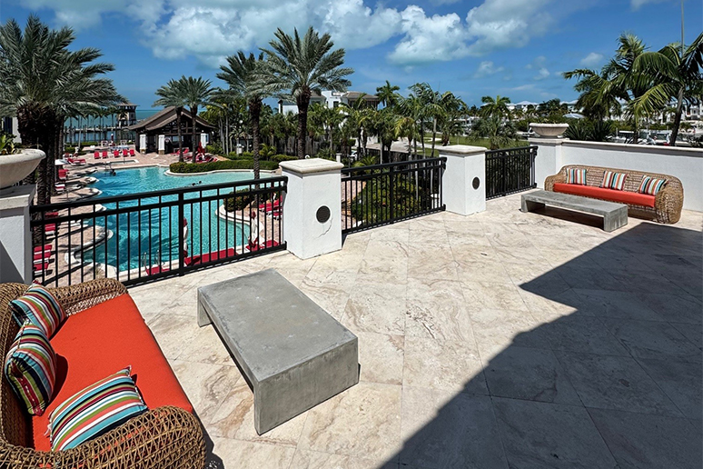 a pool with palm trees and a pool in the background