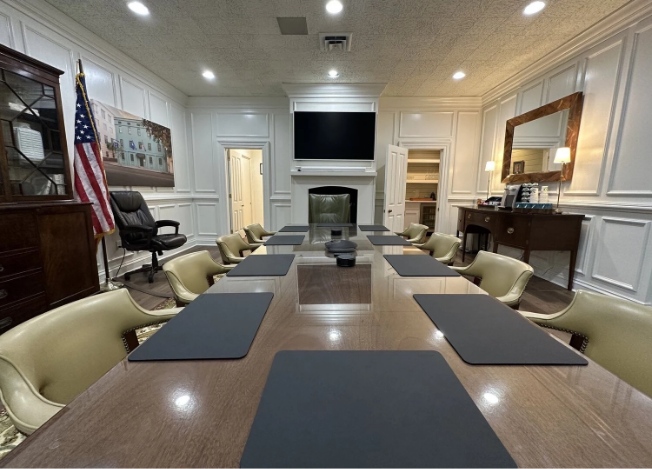 a conference room with a table and chairs