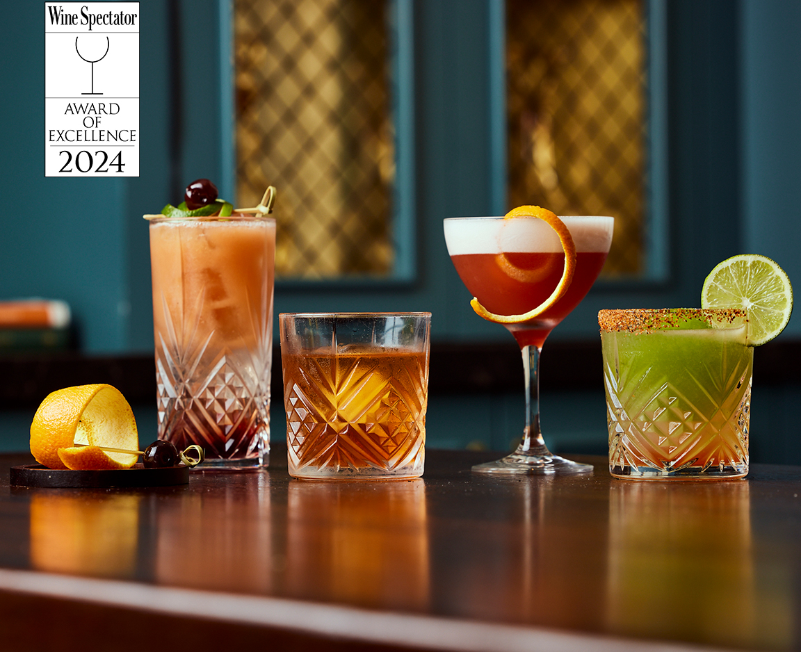 a group of drinks on a bar