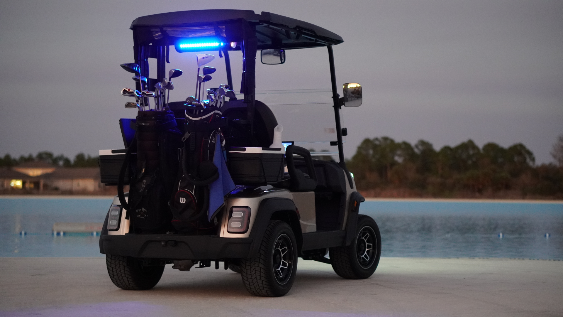 a golf cart with golf clubs