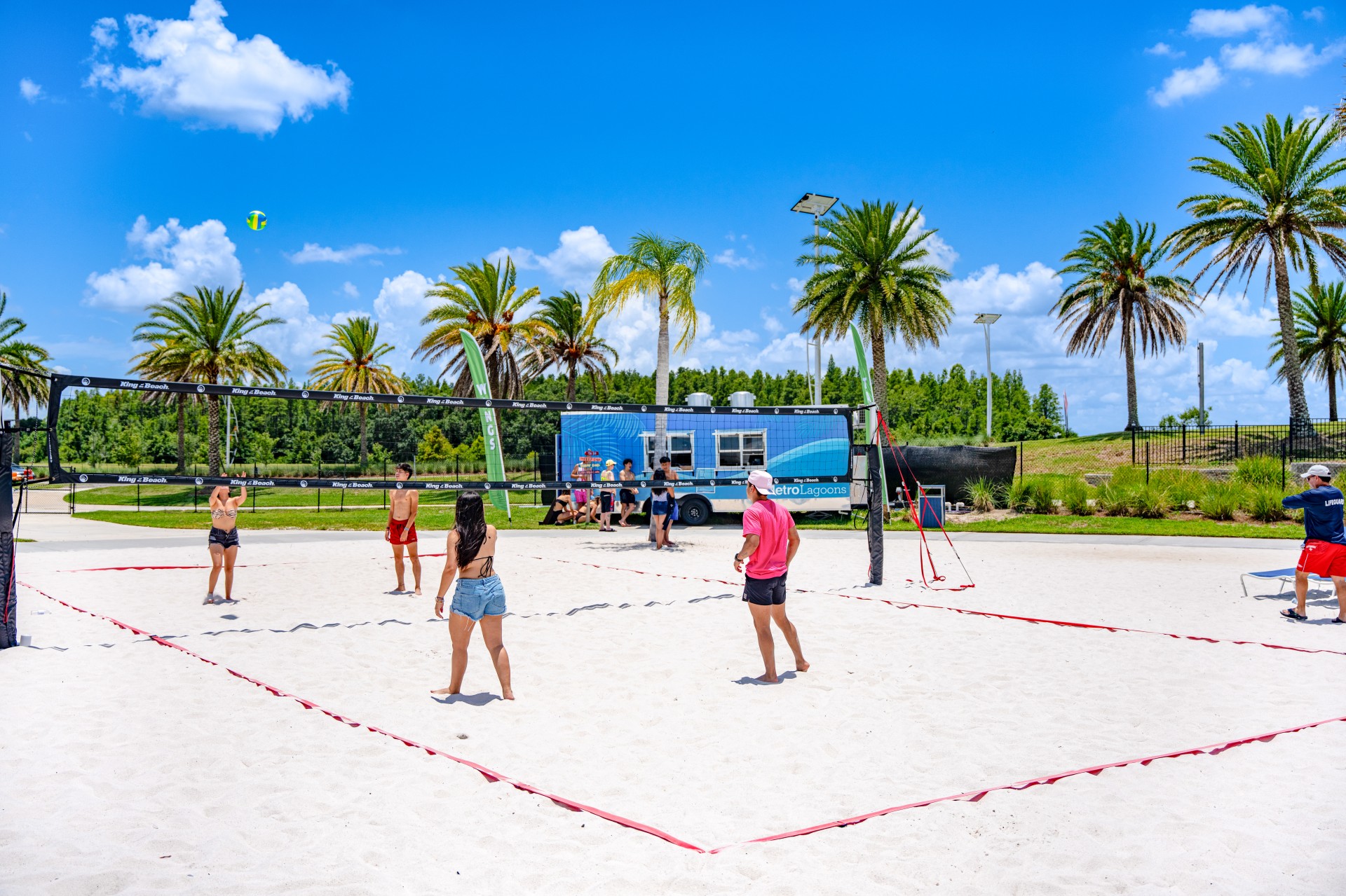 a group of people playing volleyball