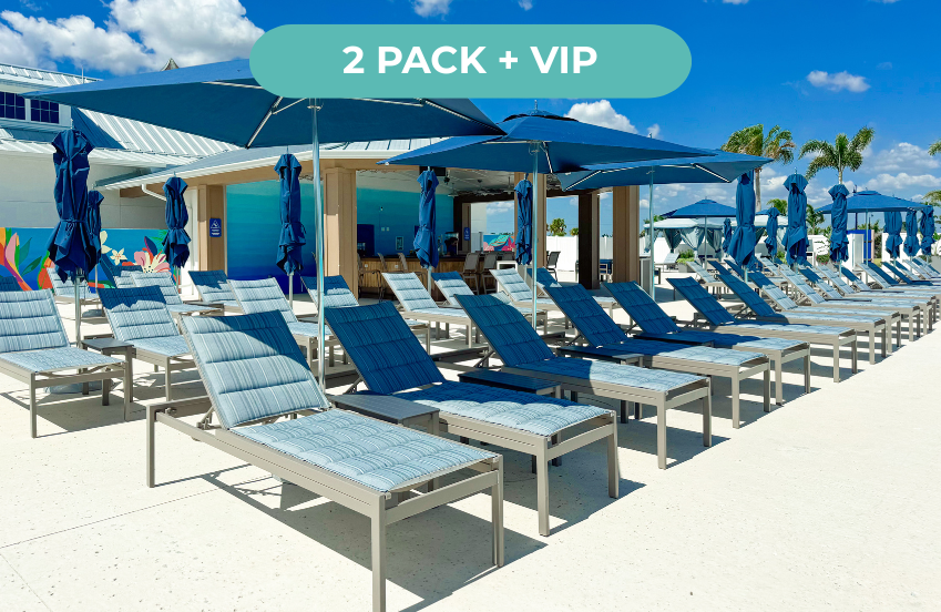 a group of lounge chairs and umbrellas