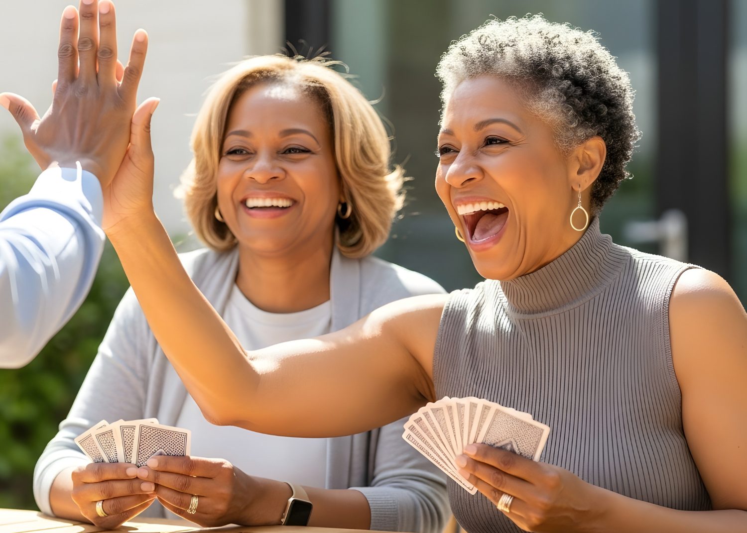 a group of women smiling and holding cards