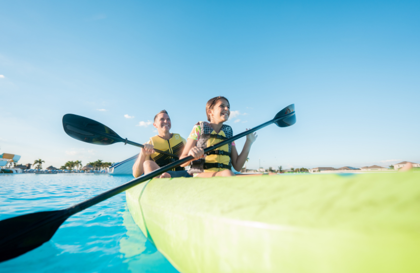 a man and woman in a canoe