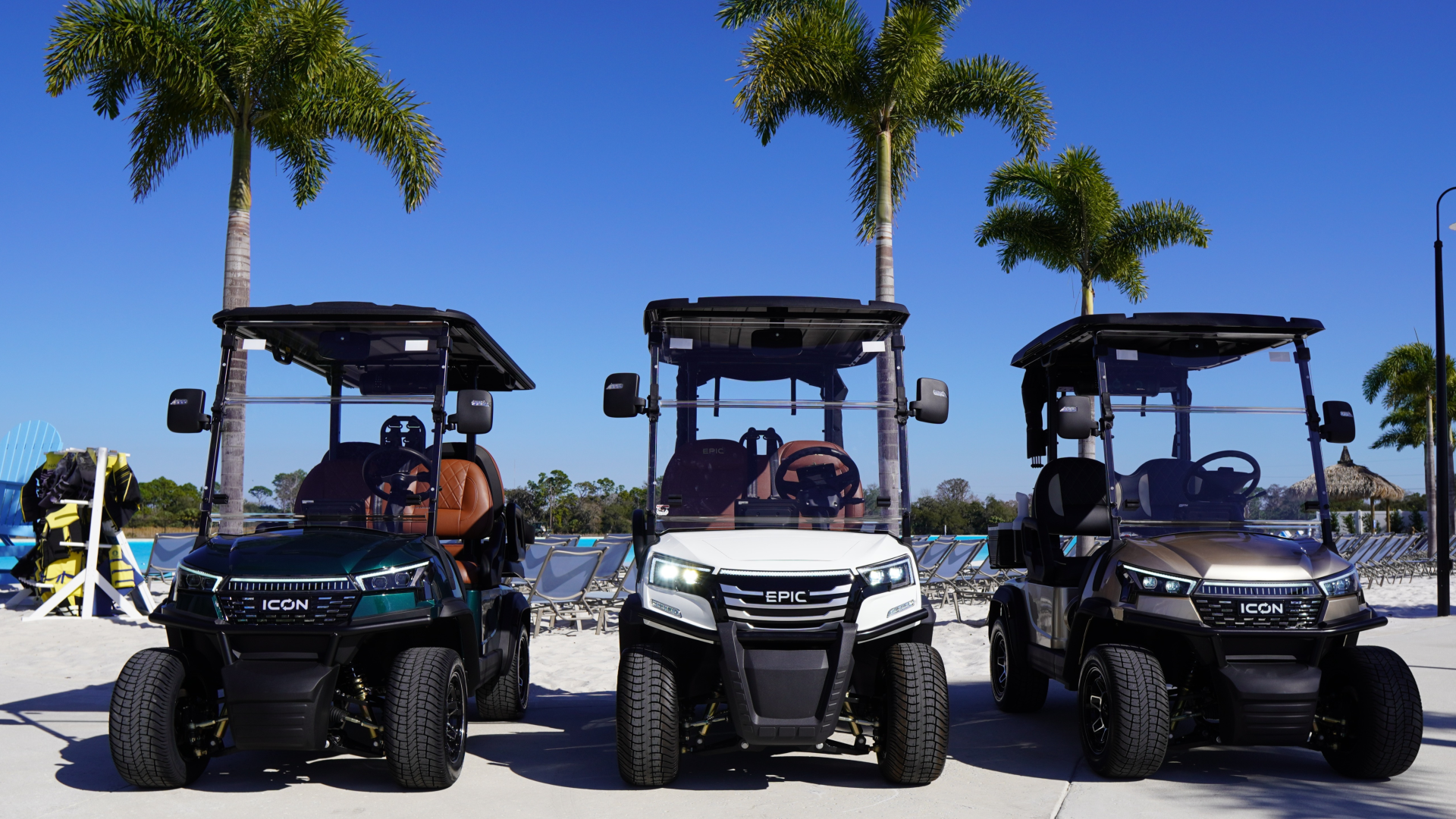 a group of golf carts parked on a beach