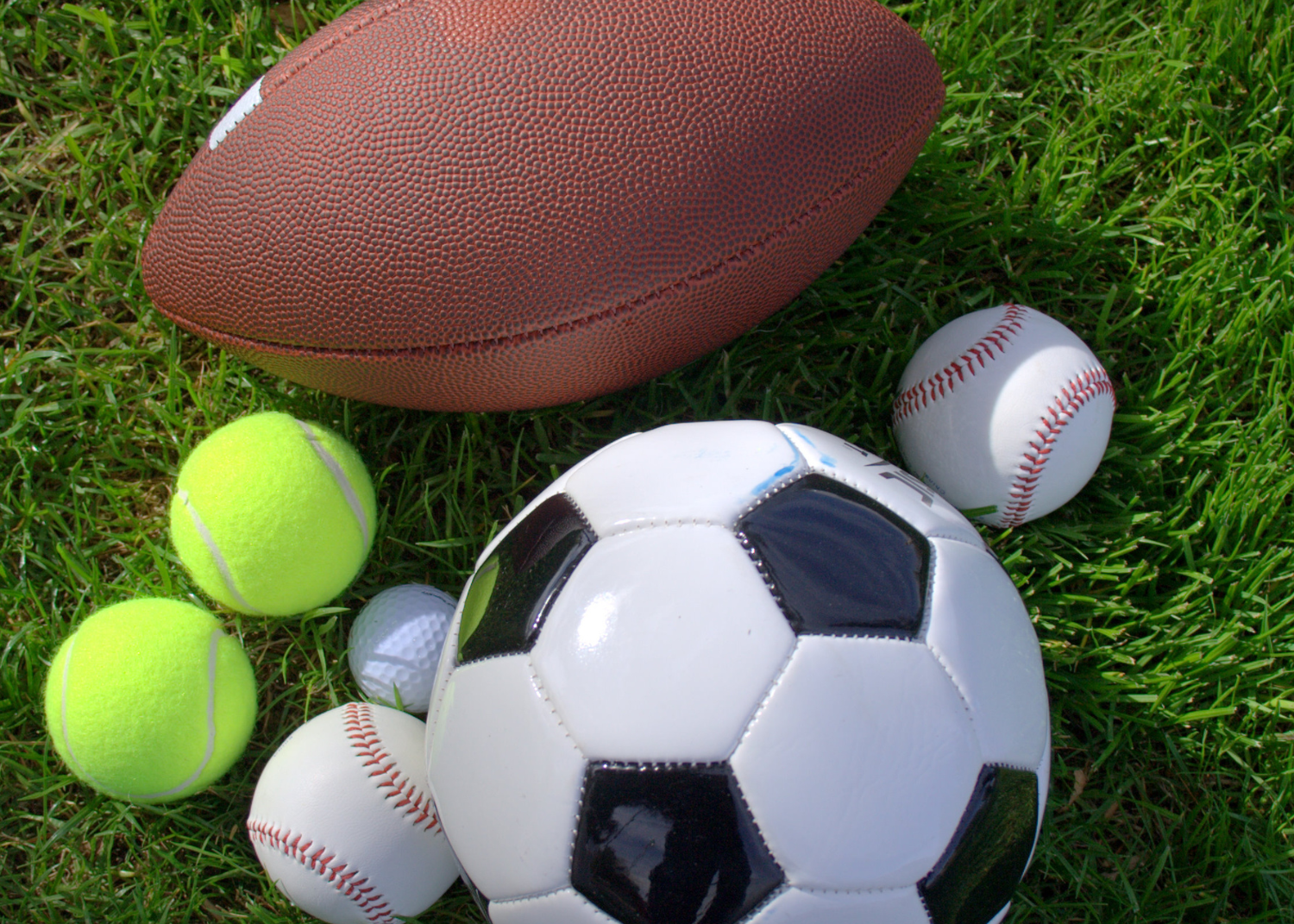 a group of balls on grass