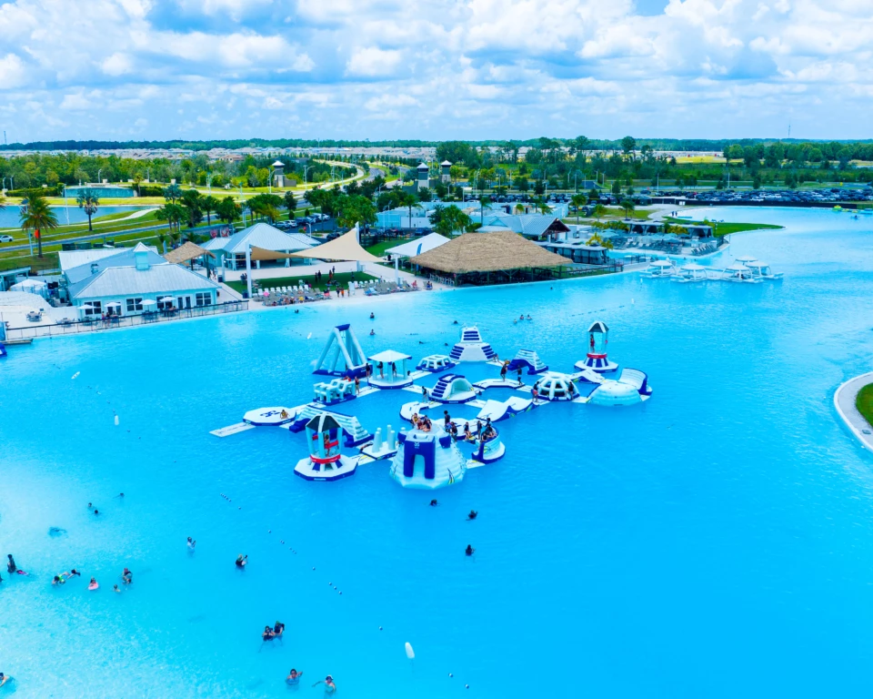 a water park with people swimming and floating rafts