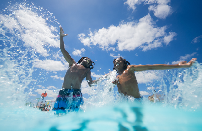 two children playing in a pool