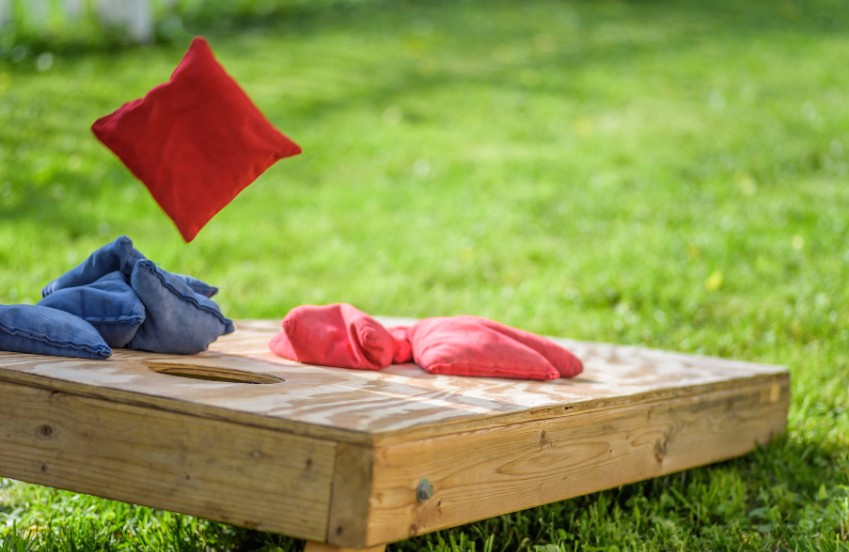a bag toss game on a wooden board