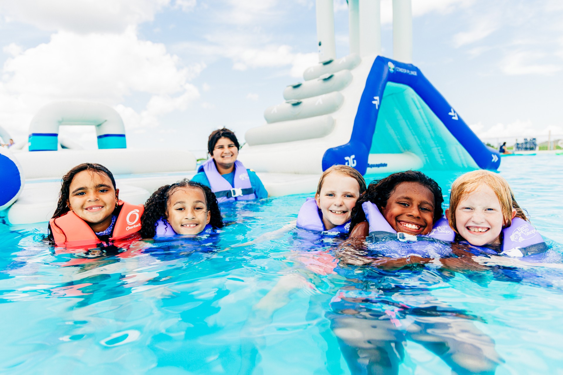 a group of children in a pool