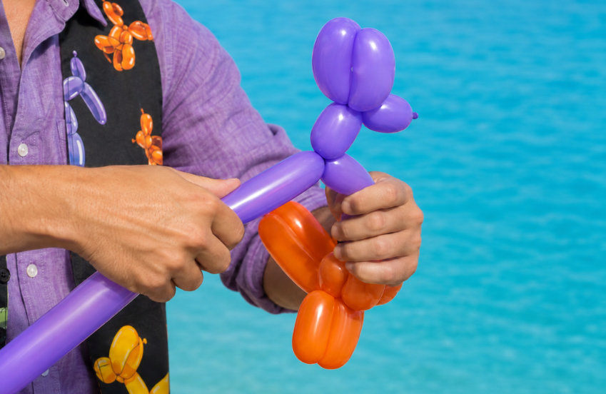 a person making a balloon animal