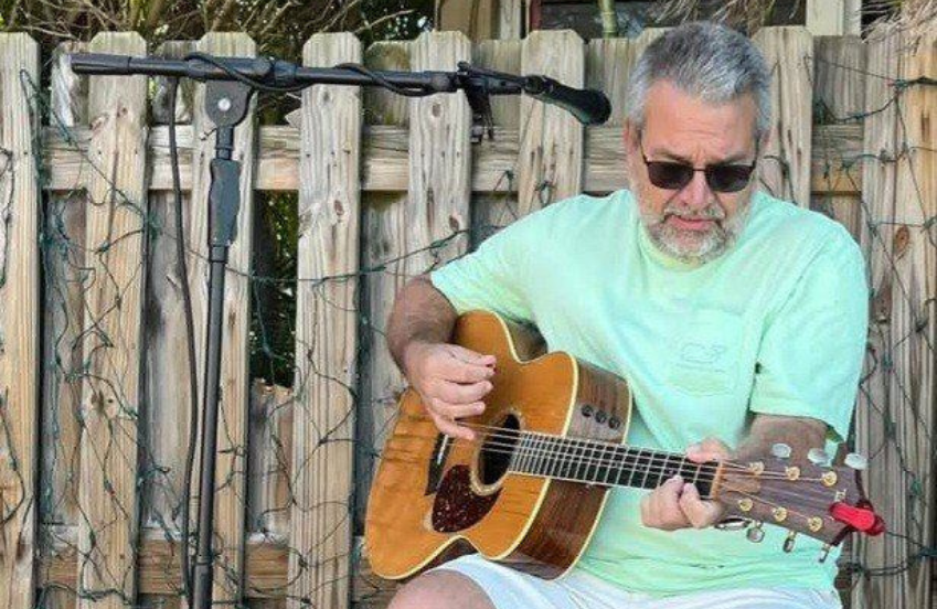 a man playing a guitar