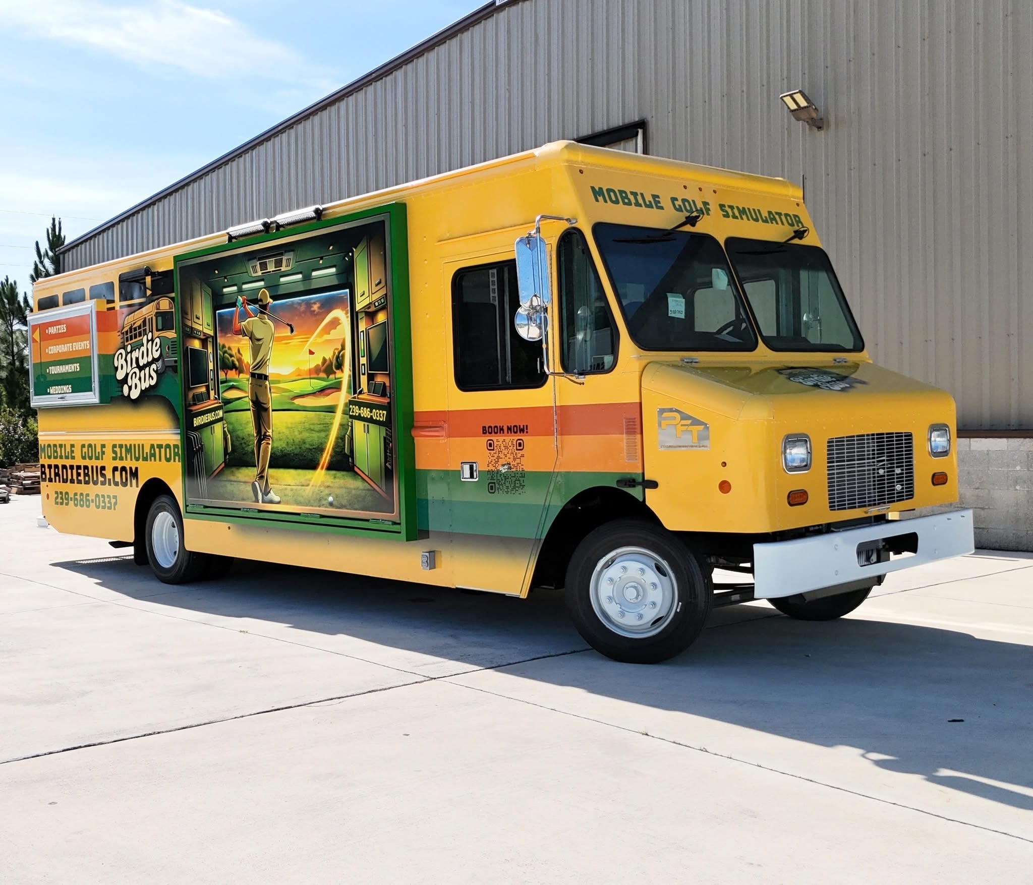 a yellow truck with a green and yellow advertisement