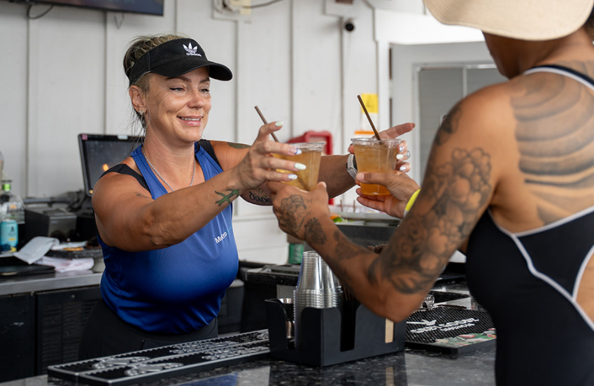 a group of women holding drinks