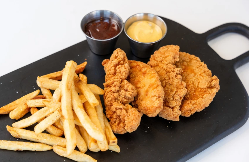 a plate of fried chicken and fries