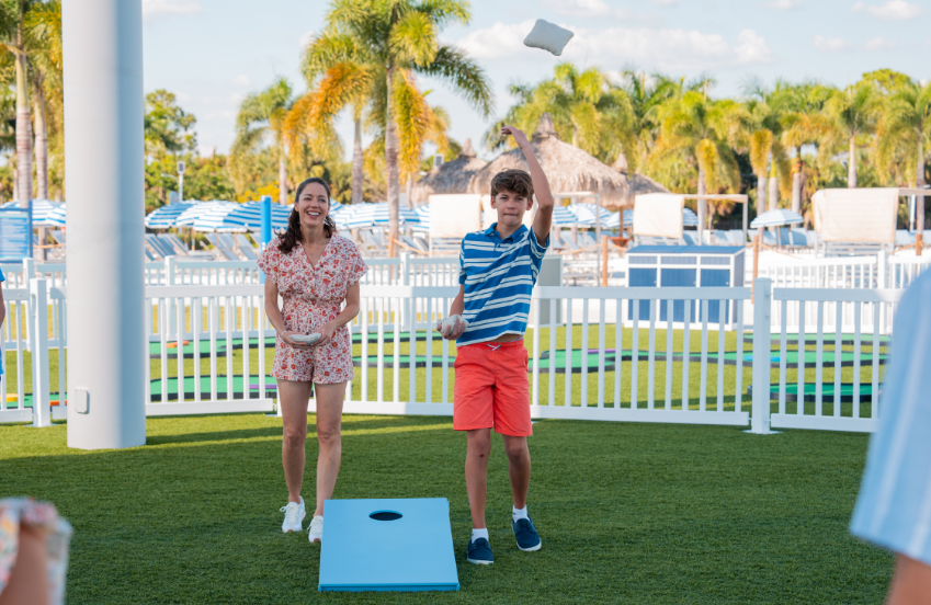 a woman and boy playing a game