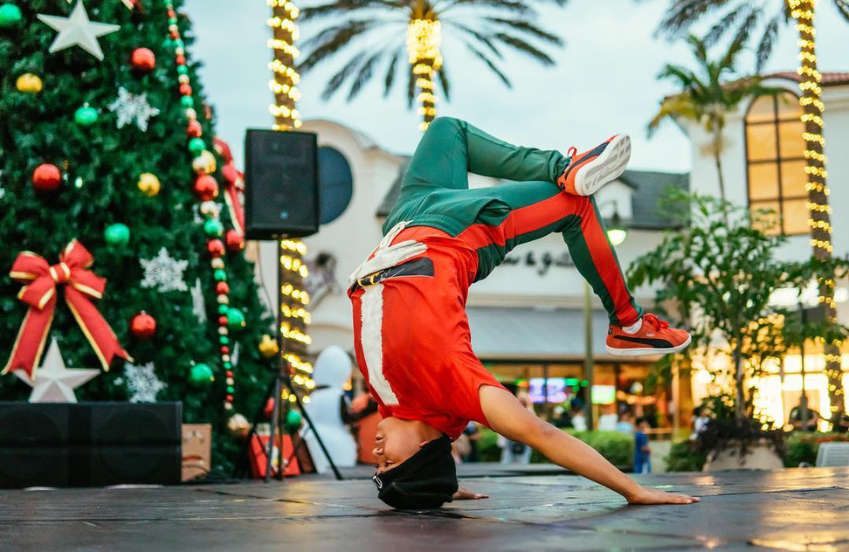 a man doing a handstand on a stage
